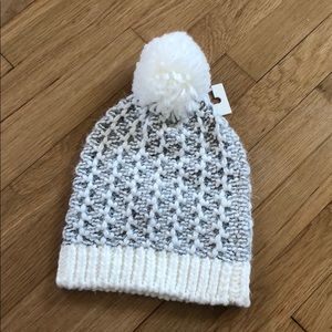 White and grey winter hat with white Pom Pom